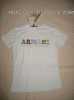 Pěkné nové tričko, bílé s barevným nápisem na hrudi Armani (vyšitý z barevných dlouhých korálků). Vel. L, strečový materiál.